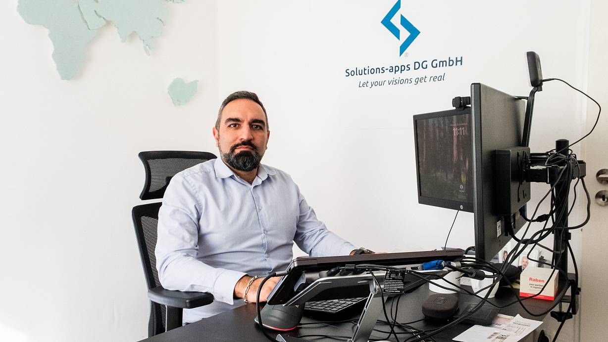 Hamed Rahimi Darehchi at his desk in the Solutions-Apps office